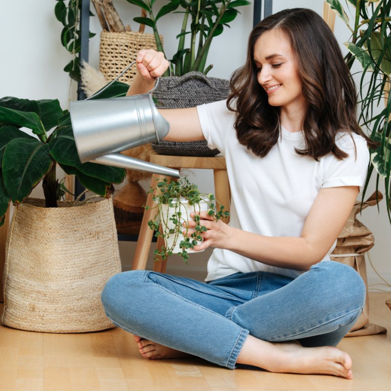 Woman Watering Plants