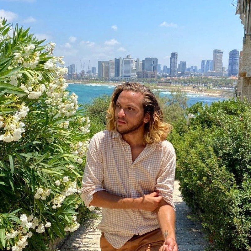 Young Male Tourist In Jaffa Old Town, Overlooking Tel Aviv, Israel