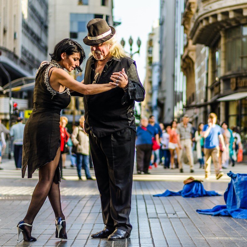 Couple dancing tango in Buenos Aires, U.S. dollar goes furthest here