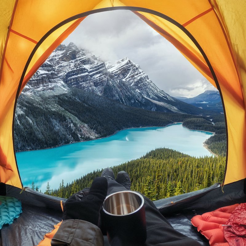 Traveler enjoying view from tent