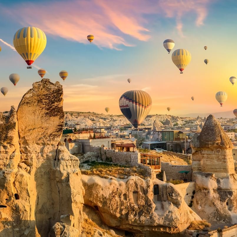 Goreme With hot air balloons at sunset, destinations