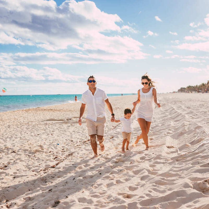 Young Family Pictured At A Tropical Beach, Mexican Caribbean