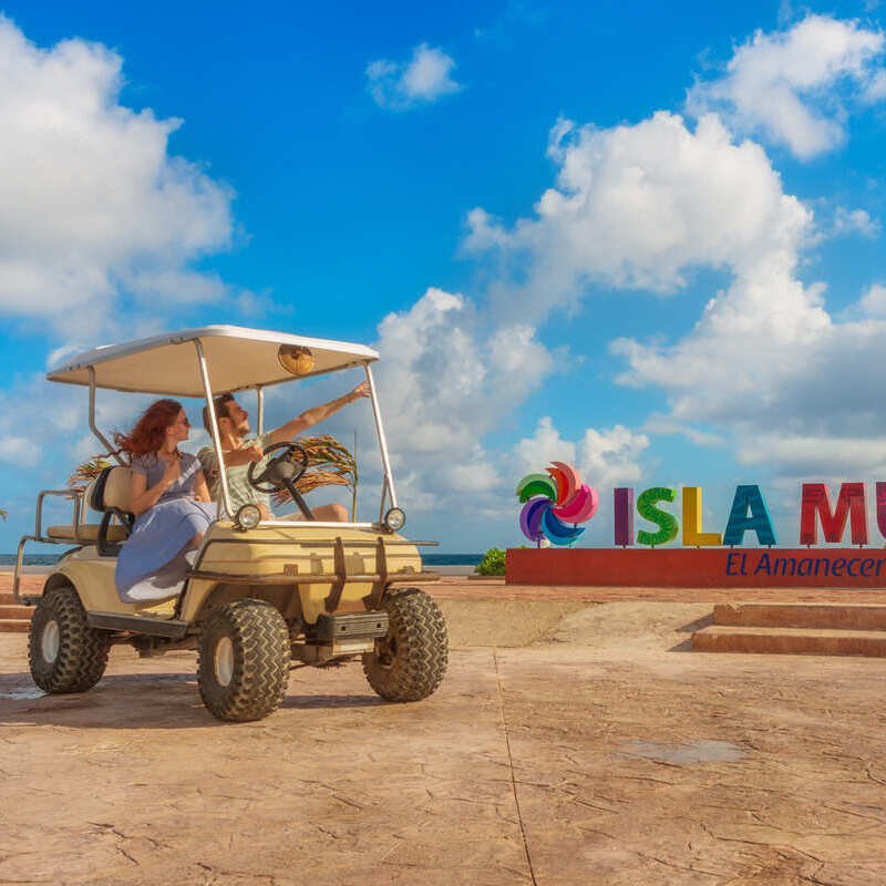 Tourists Driving A Tourist Car In Isla Mujeres, Quintana Roo