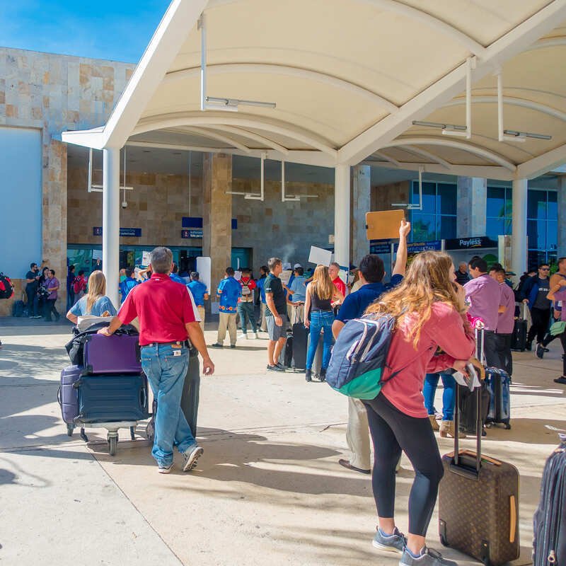 Passengers Pictured Outside The Cancun Airport International Terminal, Cancun, Mexico