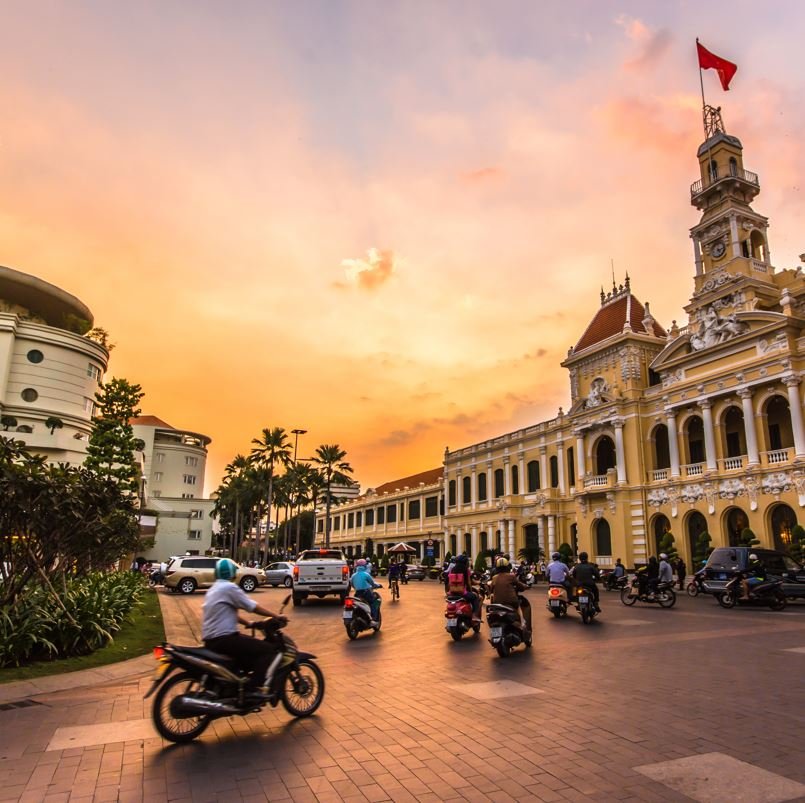 Ho Chi Minh City with people on mopeds on a busy street