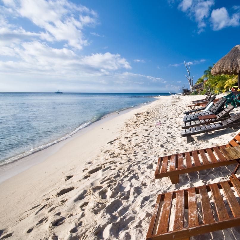 Benches on beach in cozumel