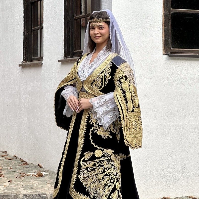 Kosovar Albanian Girl Smiling At The Camera As She Wears Traditional Albanian Attire, Pristina, Kosovo