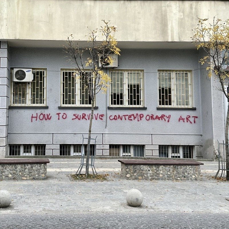 Writing On The Wall Of A Modernist Building In Prizren, Kosovo