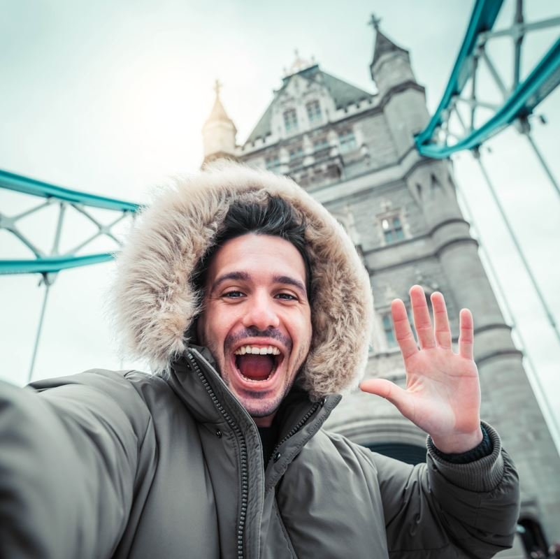 Male solo traveler on the tower bridge in london united kingdom