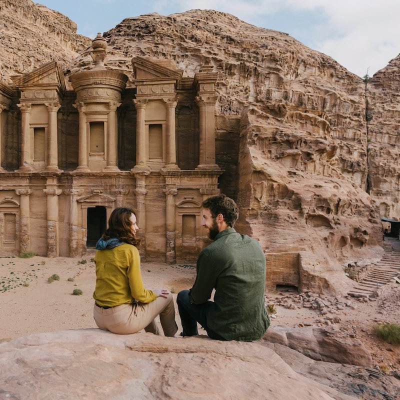 Couple looking at Monastery in Petra