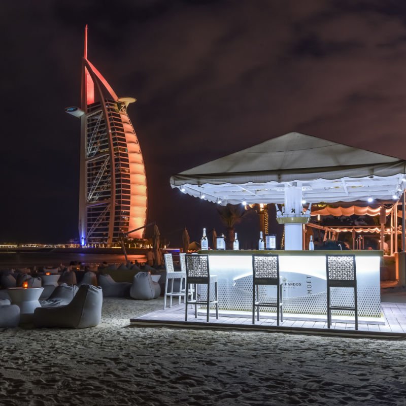 Dubai, UAE Beautiful beach bar overlooking the Burj Al Arab Hotel.