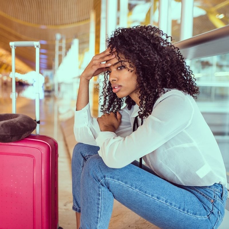 Woman,Sad,And,Unhappy,At,The,Airport,With,Flight,Canceled