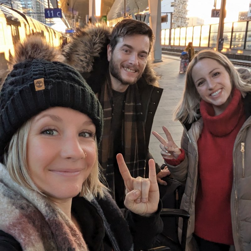 3 travelers in vienna train station after just taking the night train