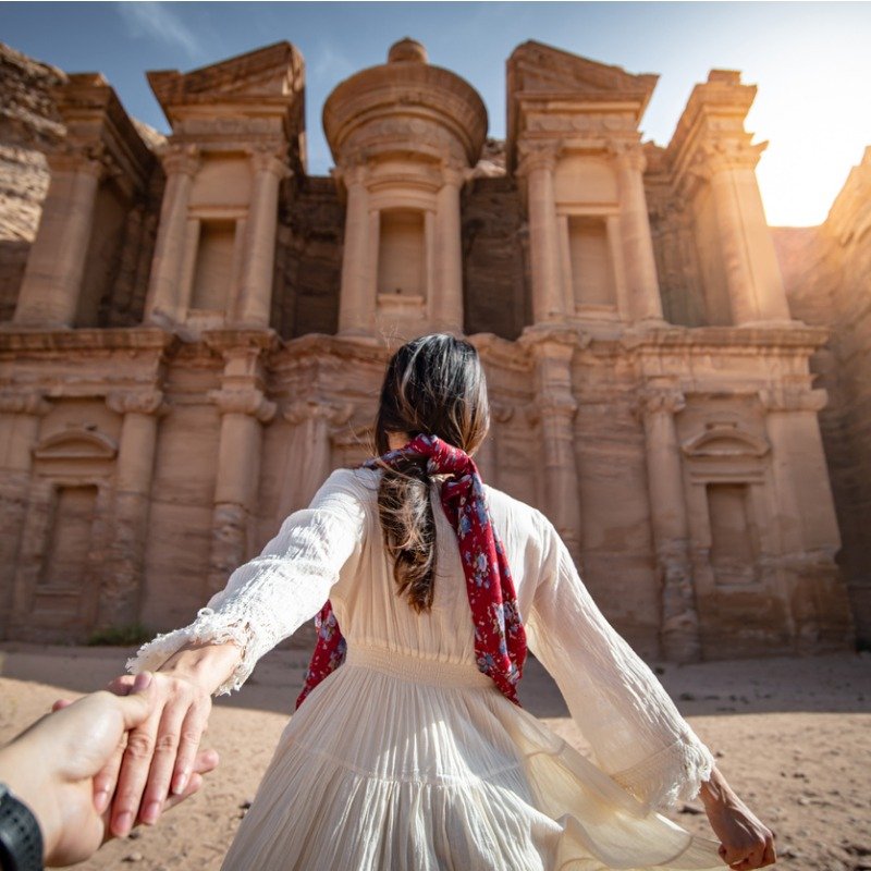 Female Tourist Holding Her Partner's Hand Visiting Petra, Jordan