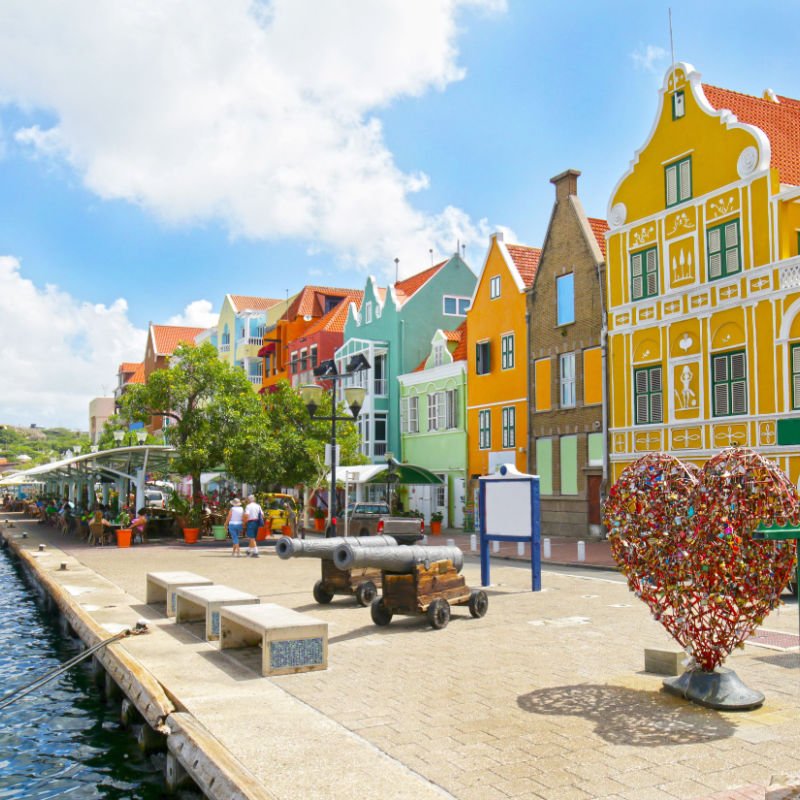 Curaçao Colourful Buildings attracting tourists from all over the world. Blue sky sunny day.