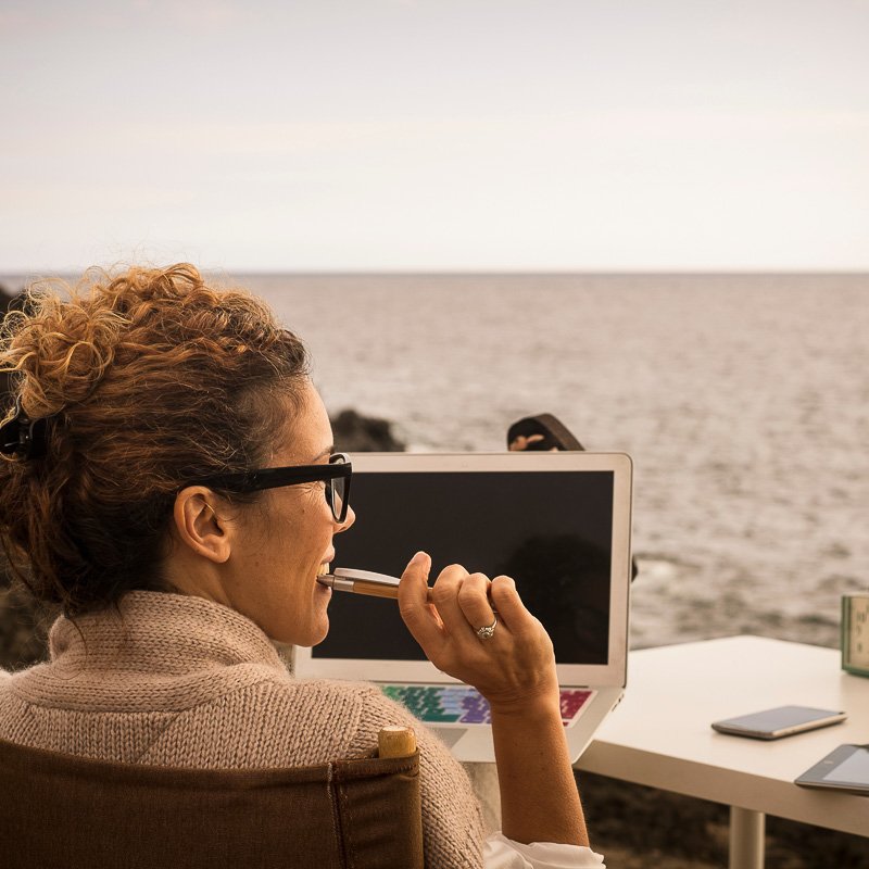 nomad working by the beach