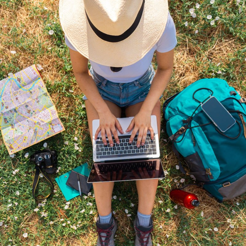 woman camping with laptop