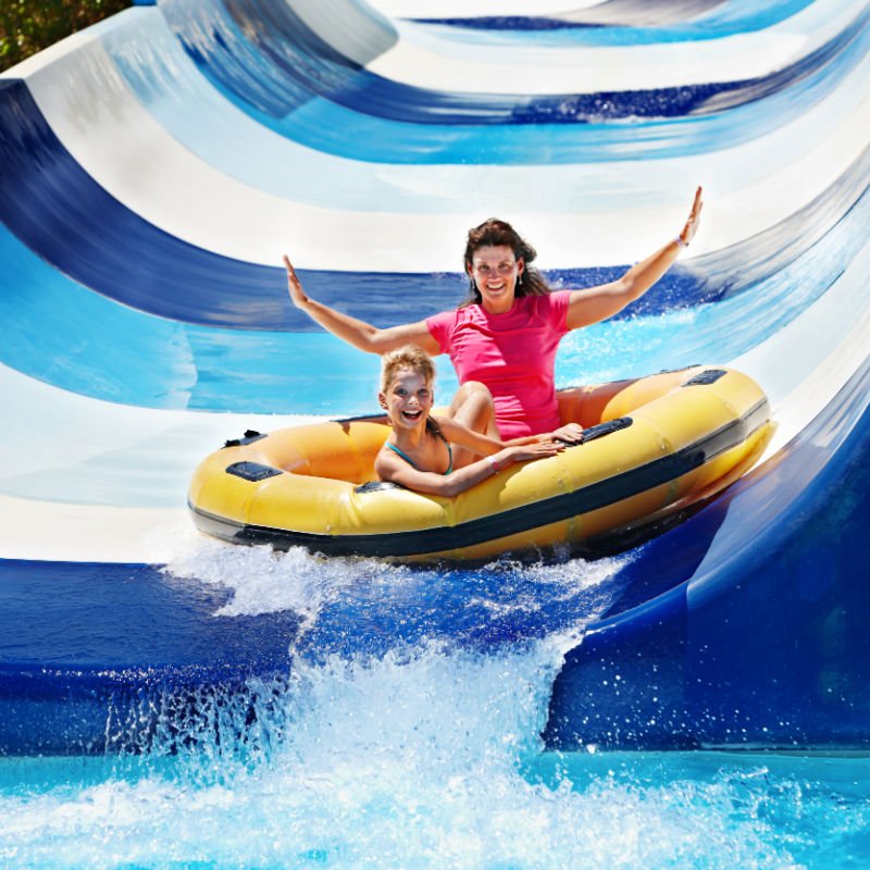 family riding a water slide