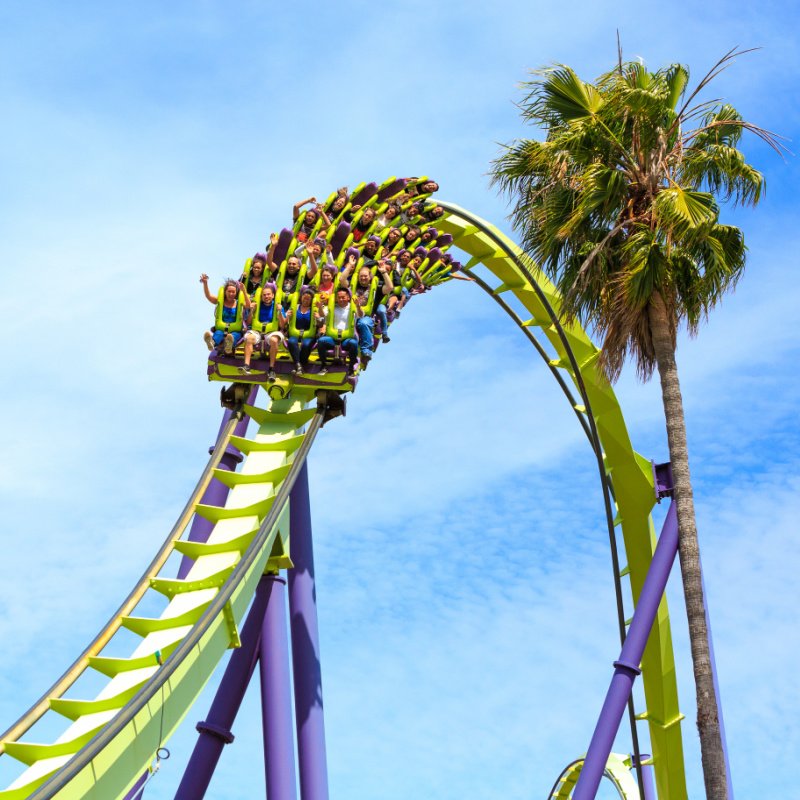 people riding roller coaster in california