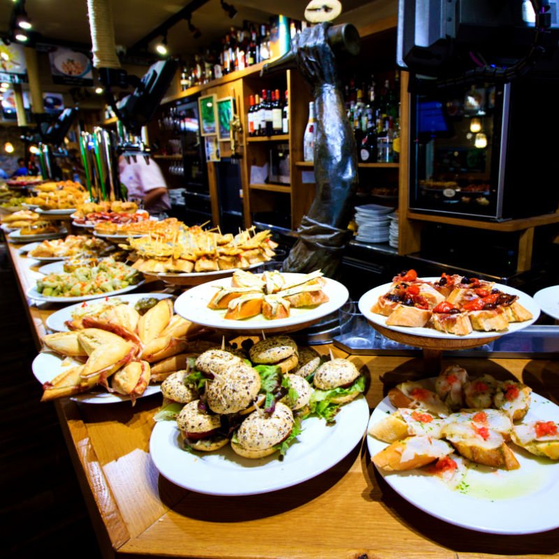 Spanish tapas laid out on a table