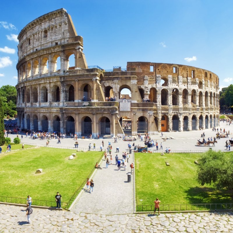 Panoramic-view-of-the-Colosseum-and-the-homonymous-square-on-a-clear-summer-day-Rome-Italy