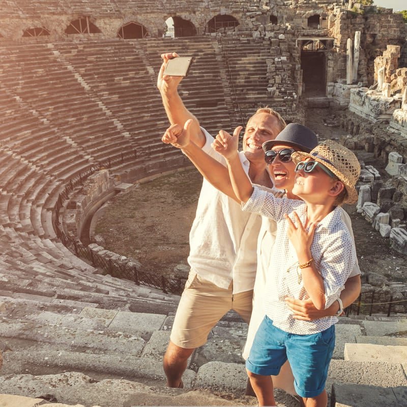 Family Taking A Selfie At The Ancient Theatre Of Side, Antalya Province, Turkey