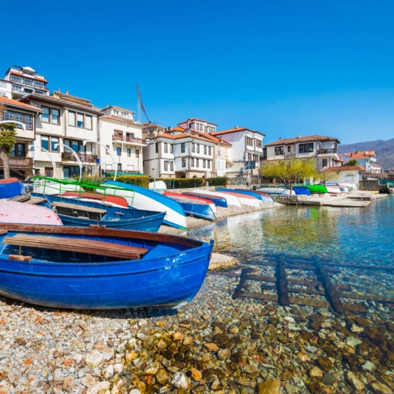 Colorful fishing boats on the shore of Ohrid lake in North Macedonia on a sunny day