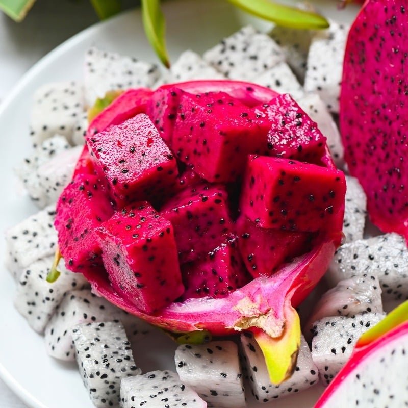 Bowl Of Red And White Dragonfruit, A Fruit Typically Found In Tropical Countries And Southeast Asia 