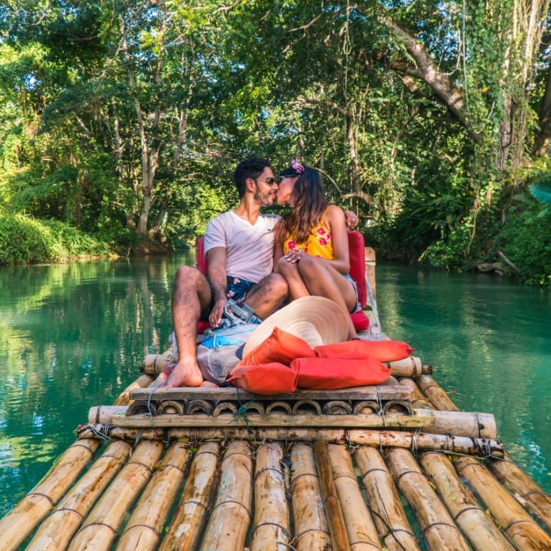 couple on rafting activity in jamaica