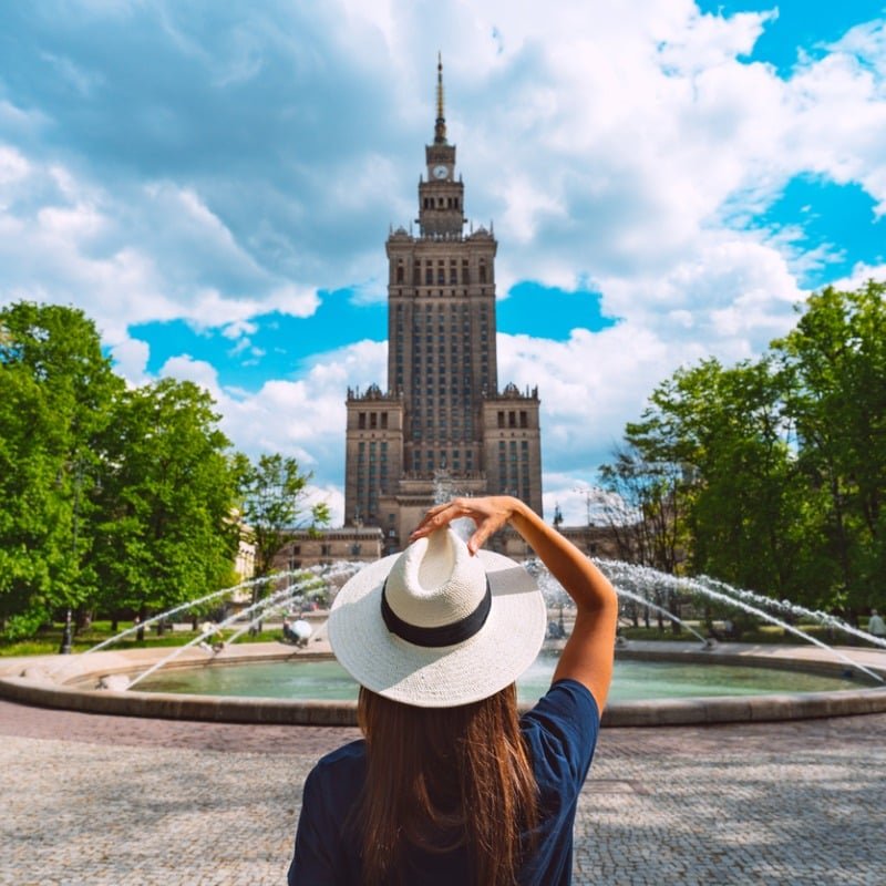 Female Traveler Facing The Polish Palace Of Culture And Science In Warsaw Poland Eastern Europe