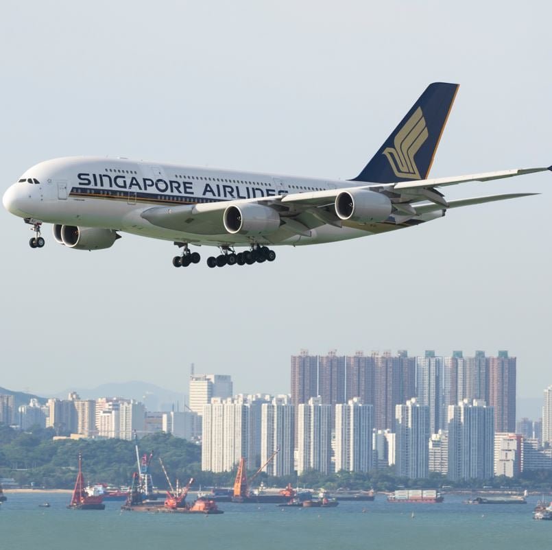 Singapore Airlines plane with city in the background