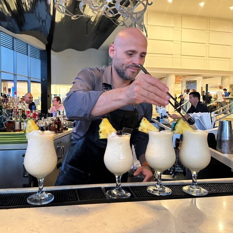 Bartender making pina coladas at Caribe Hilton in Puerto Rico