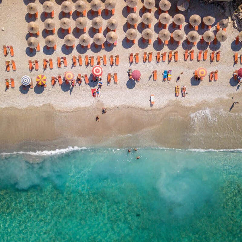 Aerial View Of A Beach In Sarande, Albanian Riviera, On The Adriatic Coast Of The Mediterranean Sea, Albania, South Eastern Europe