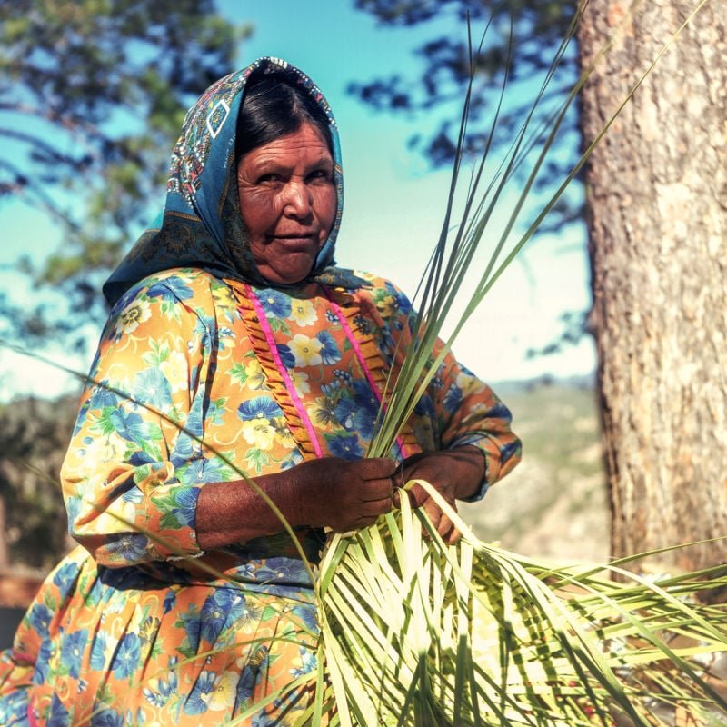 Rarámuri woman making crafts