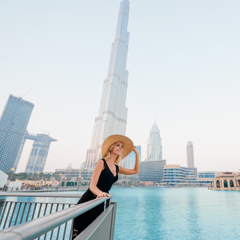 A Female Tourist In Dubai With The Burj Khalifa For Background, United Arab Emirates