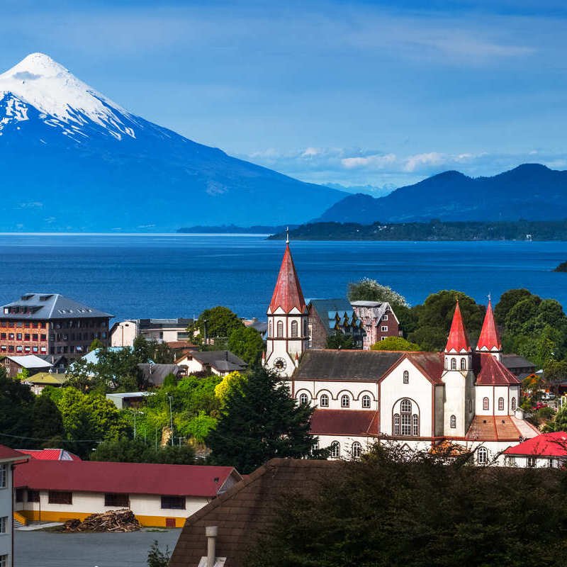 View Of Puerto Varas, A Colonial German Style Town In The Chilean Lake District, Bounded By A Snow-Capped Volcano, Chile, Latin America