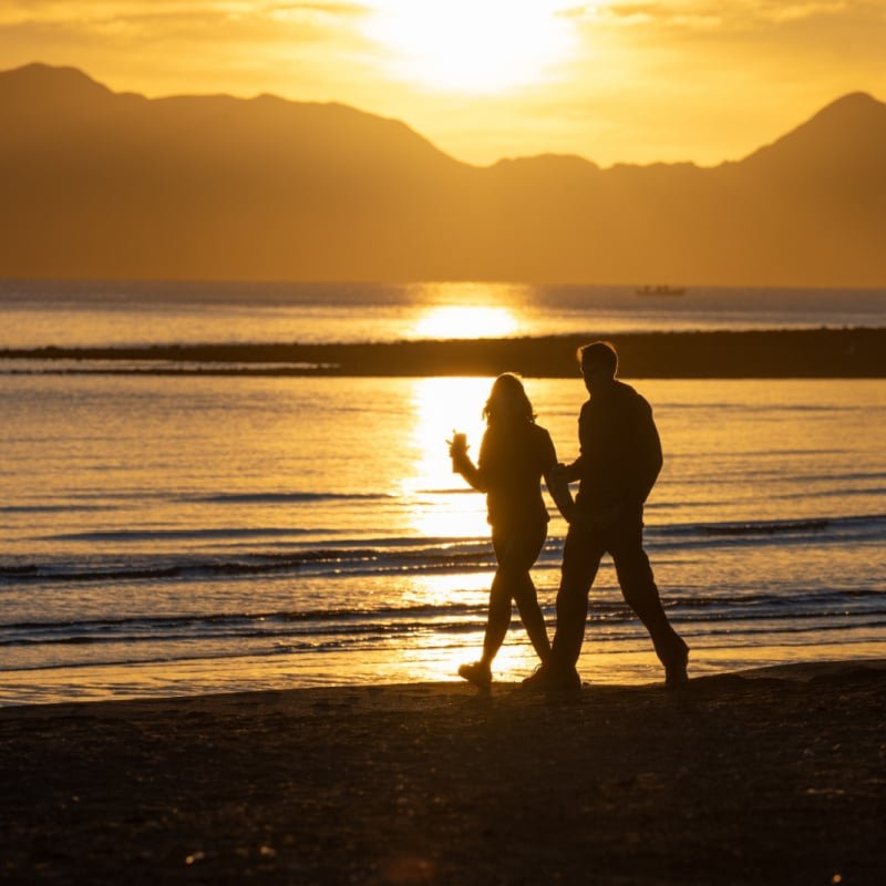 couple walking on beach in loreto