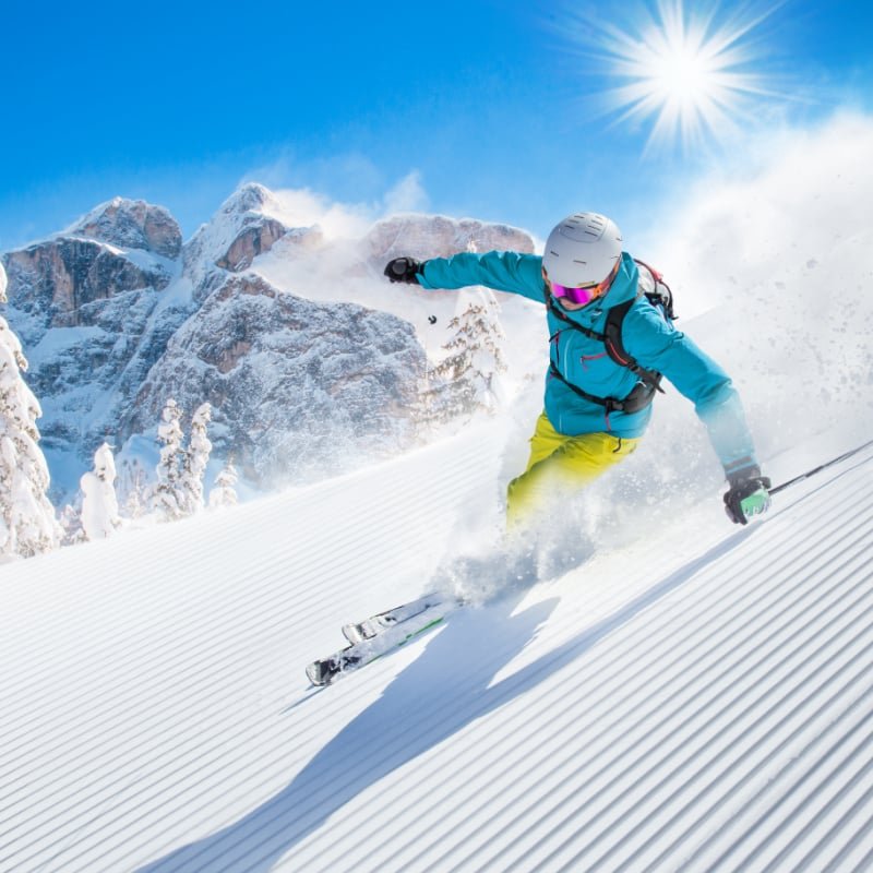 Man Skiing down a hill