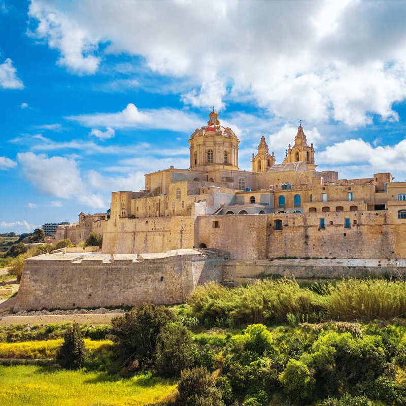 The Walled Medieval City Of Mdina Seen From The Open Fields Beneath The Citadel, Malta, An Island Nation In The Mediterranean Sea, Southern Europe