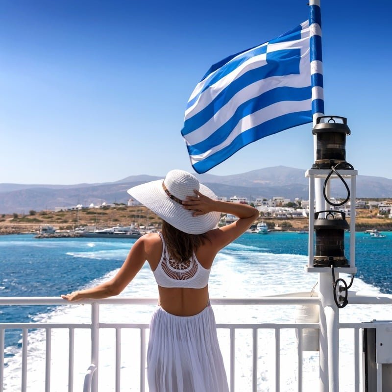 Young Female Tourist Enjoying A Ferry Boat Ride In Greece, Meditarranean Sea