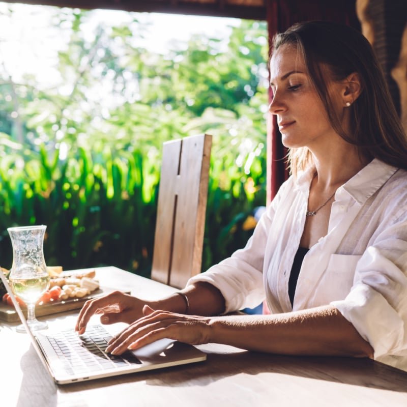 Digital Nomad Woman Working on Laptop